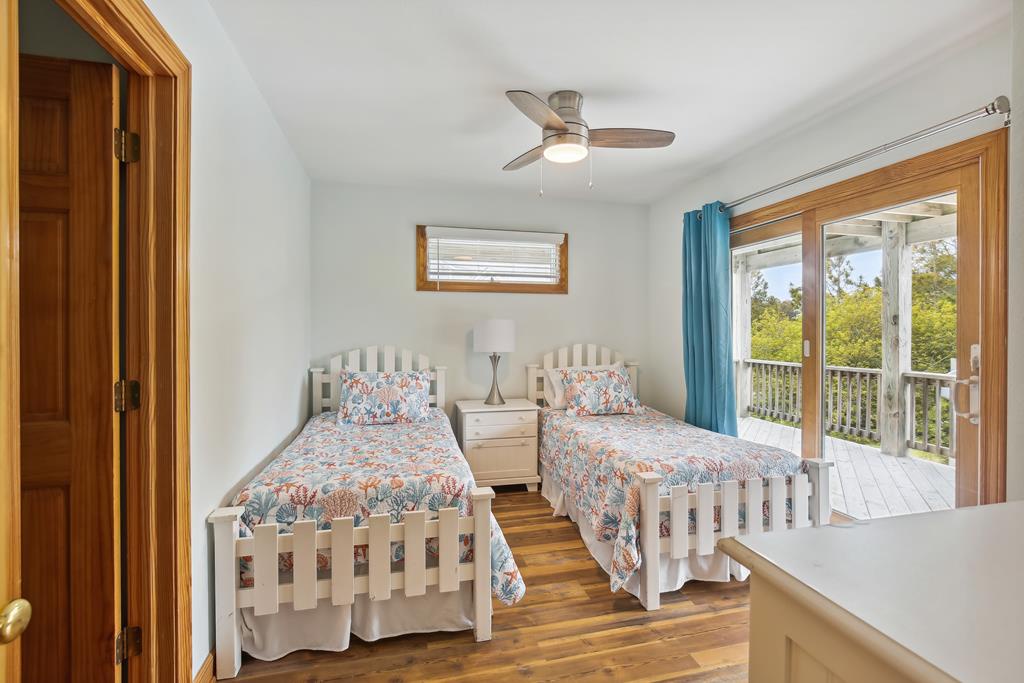 Wake up to sunshine streaming through your private balcony door, where two cozy twin beds invite restful mornings. Step outside to breathe in the peaceful greenery and start your day refreshed.