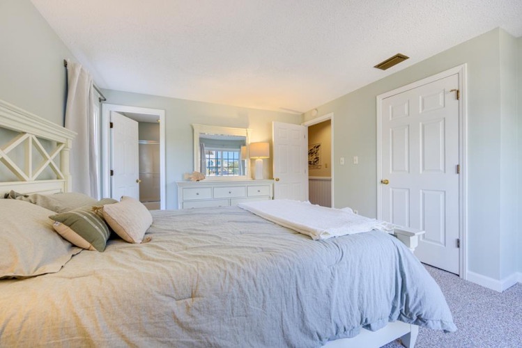 Drift off in this peaceful bedroom where soft linens and calming tones invite your most restful sleep. Ample storage and an en-suite bathroom make settling in effortless.