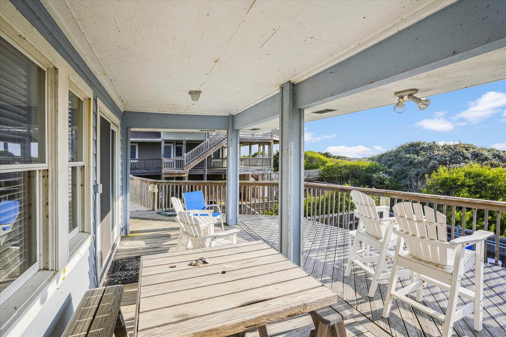 Relax in these Adirondack chairs on your private balcony, where lush greenery stretches before you and warm sunshine filters through. Perfect for morning coffee or watching the day unfold.