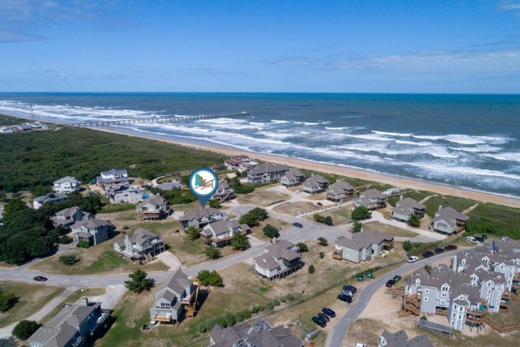 Coastal community nestled between lush greenery and pristine oceanfront, offering easy beach access and scenic surroundings for your seaside retreat.