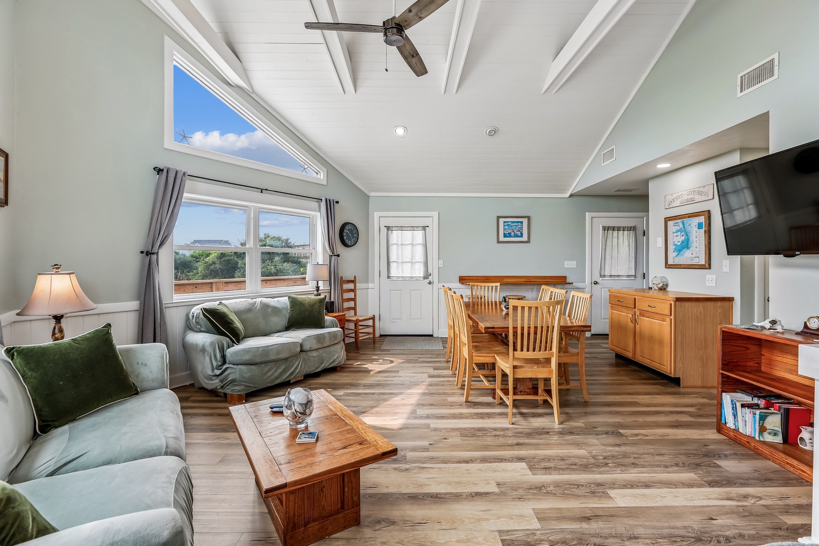 Your home away from home features a spacious open floor plan with vaulted ceilings, natural light, and a cozy living area that flows into the dining space—perfect for gathering after a day of adventure.