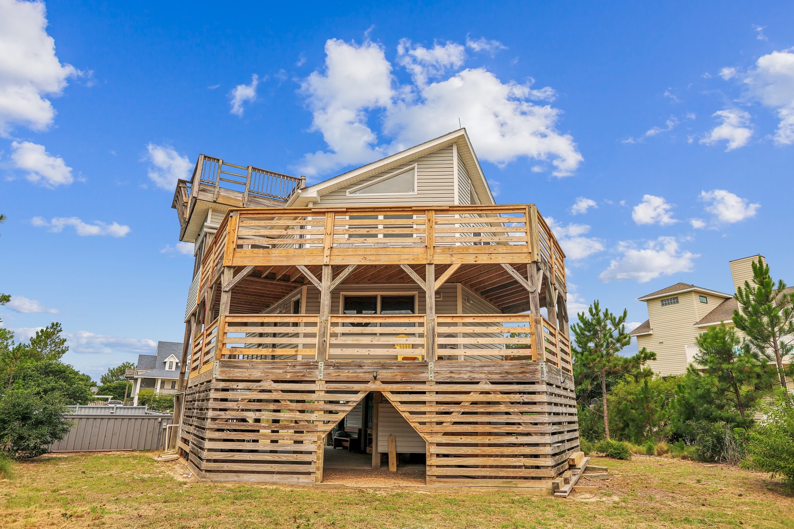 A multi-level coastal retreat with spacious decks offers views of natural surroundings and easy access to nearby beaches and attractions.