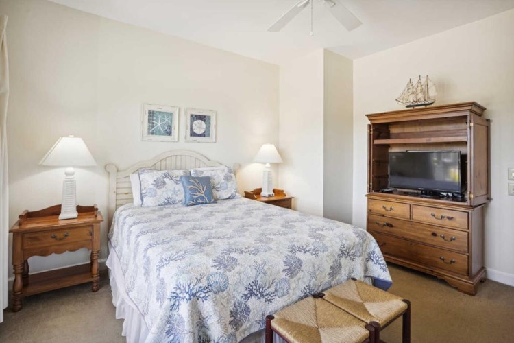 Sink into the plush coastal bedding and enjoy your favorite shows on the flat-screen TV before drifting off to a peaceful night's sleep in this serene, nautical-themed retreat.