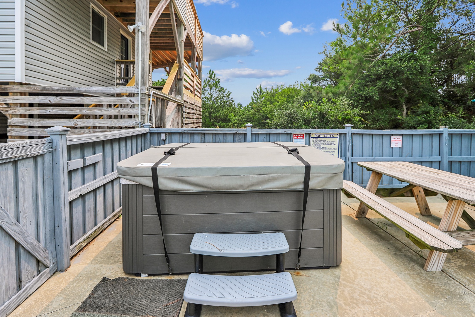 Slip into your private hot tub under open skies—your perfect spot to unwind after a day exploring the coast.