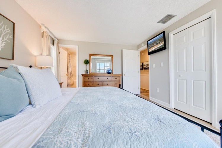 Unwind in your serene coastal retreat with soft linens, soothing blue tones, and a comfortable space designed for restful nights and peaceful mornings.