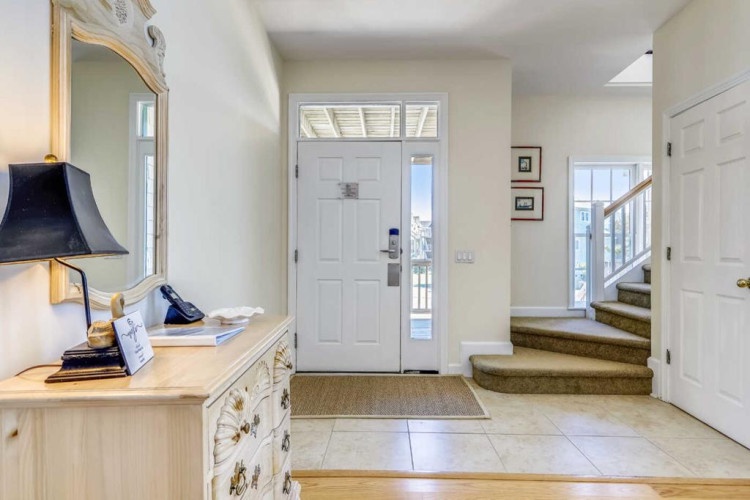 Step into your private retreat through this bright, welcoming entryway. Warm natural light and a cozy layout invite you in, ready for your next getaway.