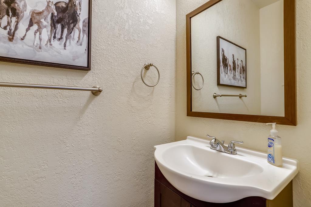 Freshen up in this charming bathroom with warm desert tones, stylish camel artwork, and thoughtful touches that make you feel right at home during your stay.