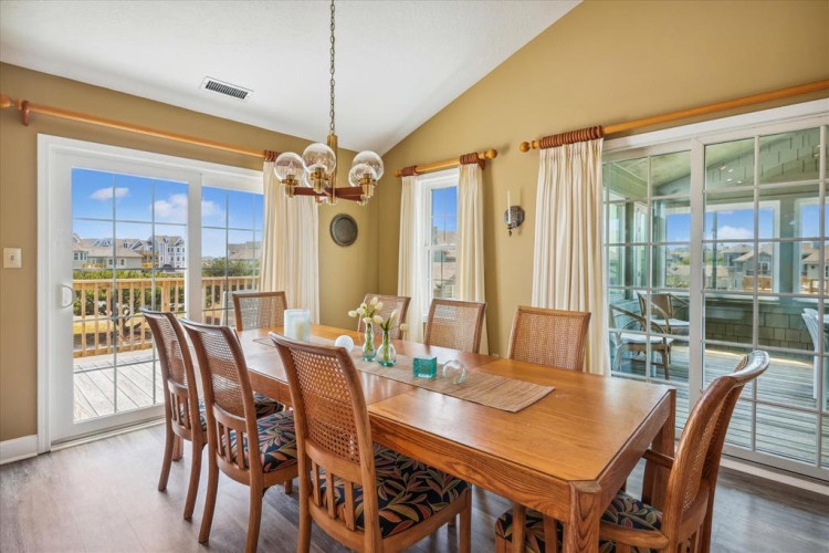Gather around the warm wood table in your sunlit dining room, where ocean breezes and scenic views create the perfect setting for memorable meals together.