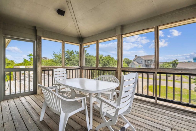Dine al fresco on your private screened-in porch, where refreshing breezes and serene green views create the perfect backdrop for morning coffee or evening meals.