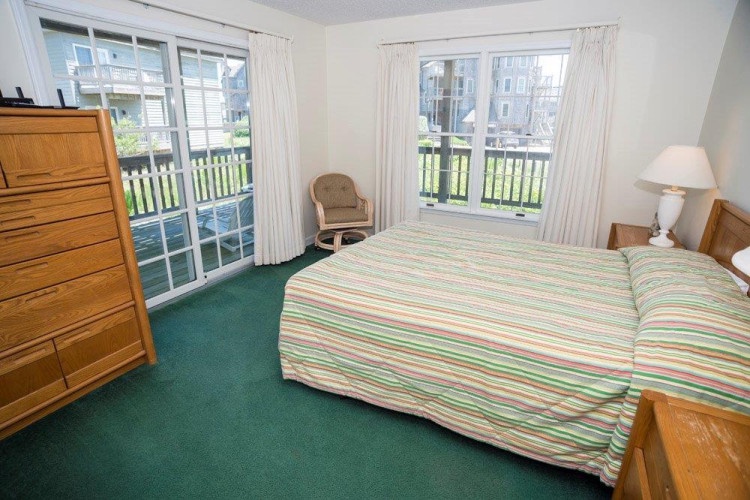 Relax in your peaceful bedroom with fresh coastal breezes through your private glass doors. Step out to your deck and soak in the greenery and sunshine.