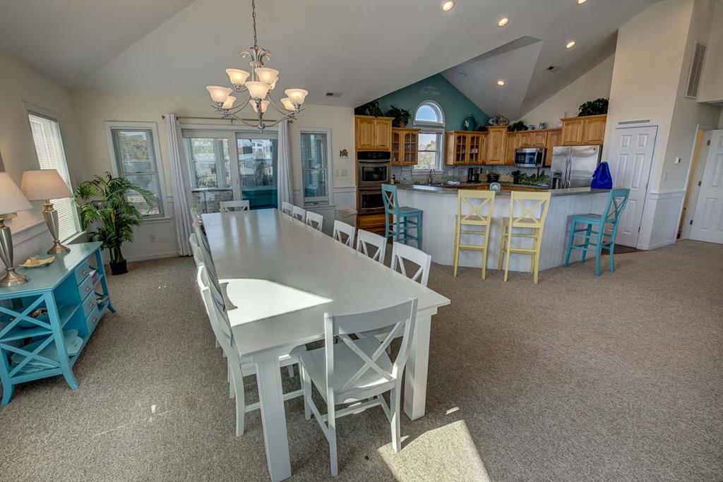 Gather around the spacious dining table with your group, then move to the bright open kitchen where everyone can help or relax at the breakfast bar together.