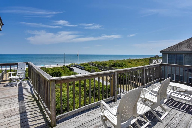 Picture yourself unwinding on this sunny deck with coastal breezes and endless ocean views. Sink into a lounge chair with your favorite book as waves roll in the background.