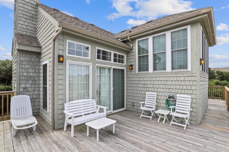 Unwind on your private deck with comfortable seating, perfect for morning coffee or evening relaxation while taking in the surrounding views.