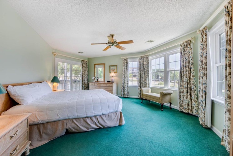Wake up refreshed in your spacious master suite with peaceful views, plenty of natural light, and a cozy ceiling fan to keep you comfortable.