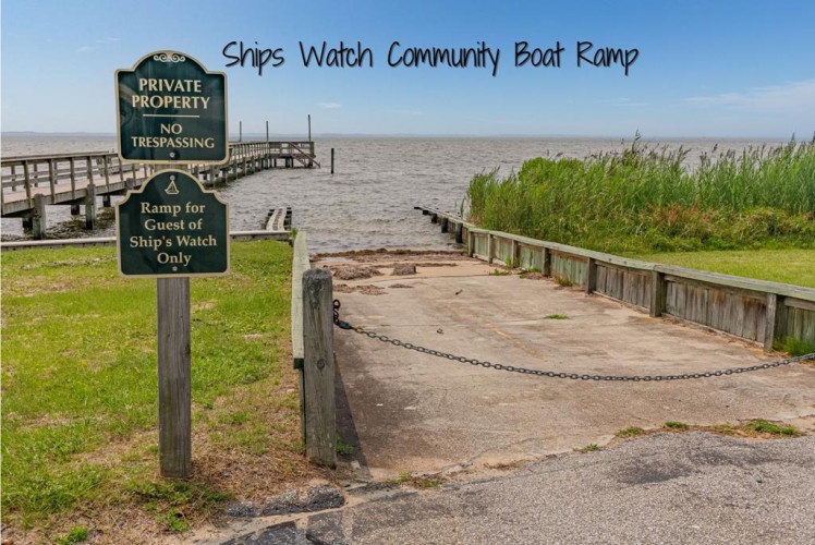 Ships Watch Community Boat Ramp offers waterfront access to the expansive bay, with wooden docks, a private launch area, and scenic water views surrounded by coastal marshland.