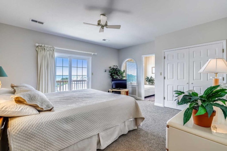 Wake up to coastal views from your spacious bedroom, where soft linens and a gentle sea breeze set the tone for a relaxing escape.