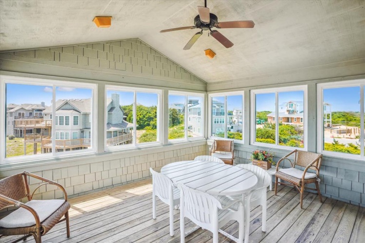 Picture yourself relaxing in this sun-drenched space, where coastal breezes flow through panoramic windows and soft natural light fills the room. Your ideal retreat for morning coffee or evening conversations.