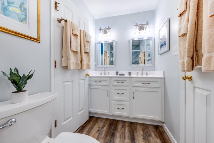 Refresh in this beautifully styled bathroom featuring dual vanities, soft lighting, and coastal-inspired decor to make your morning routine feel effortless.