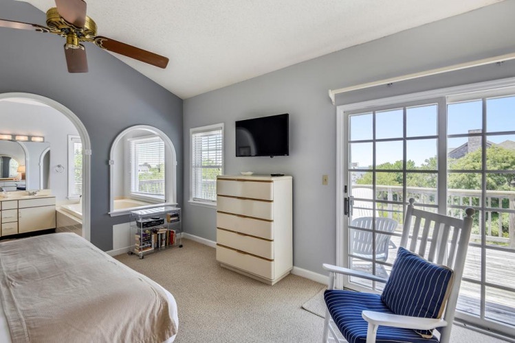 Step into your serene retreat with mountain views and direct balcony access. The bright, spacious bedroom invites you to unwind while nature fills your windows.