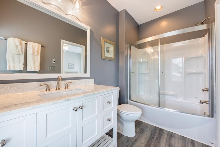 Your private bathroom features elegant marble counters, soft towels, and a spotless shower-tub combo—everything you need to unwind after a day of exploring.