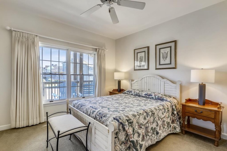 Step into your peaceful retreat with a plush bed, calming décor, and soft natural light streaming through the windows—your perfect spot to unwind after a day of adventure.