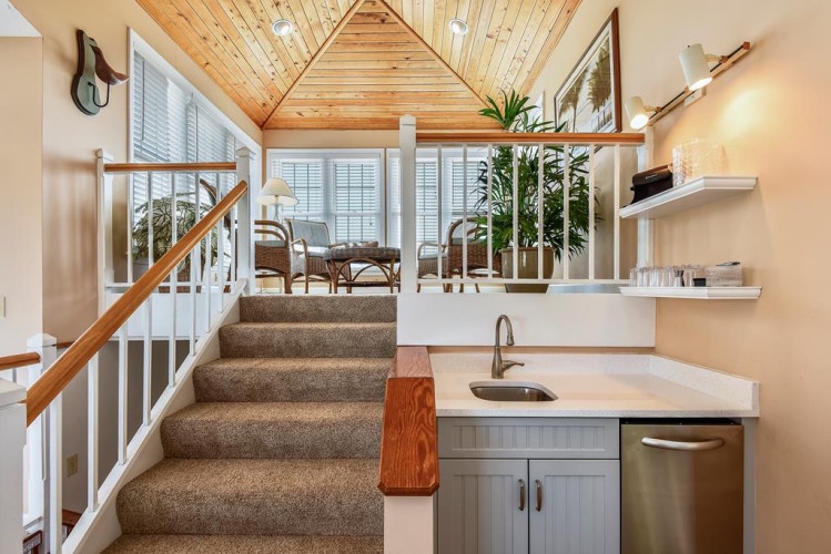Sunlight fills this bright loft space where cathedral ceilings and charming kitchenette invite you to relax and unwind during your stay.
