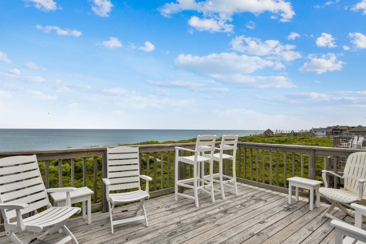 Unwind with sweeping ocean views from this spacious deck, where comfortable seating invites you to soak in coastal breezes and endless horizons.