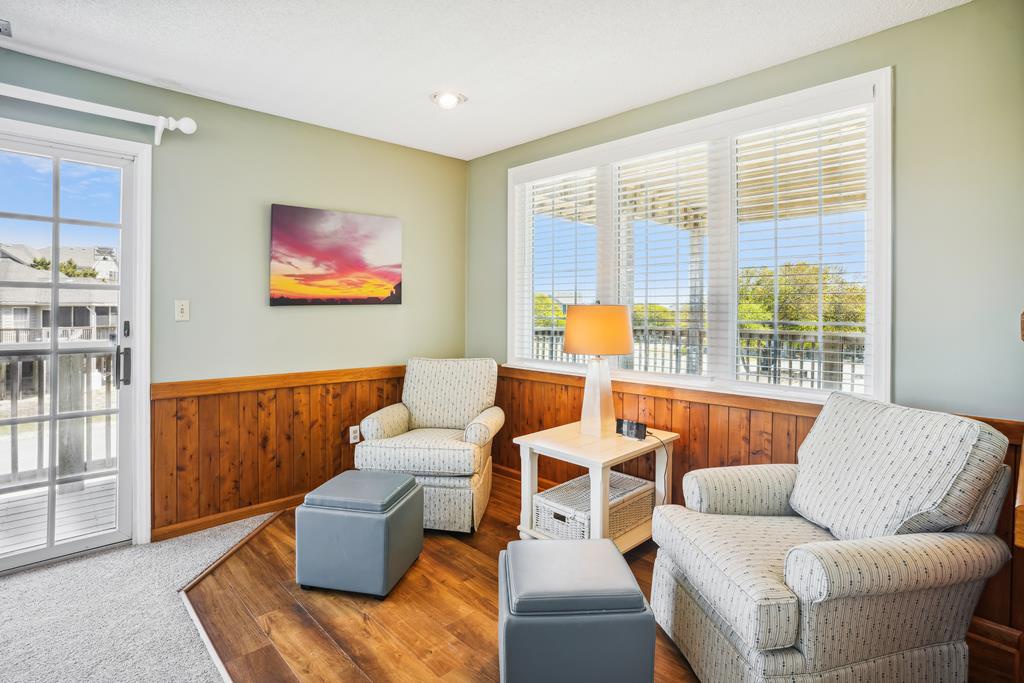 Sink into plush seating and soak up natural light in your cozy living space. Warm wood accents and soft tones create the perfect retreat for relaxation after a day of adventure.