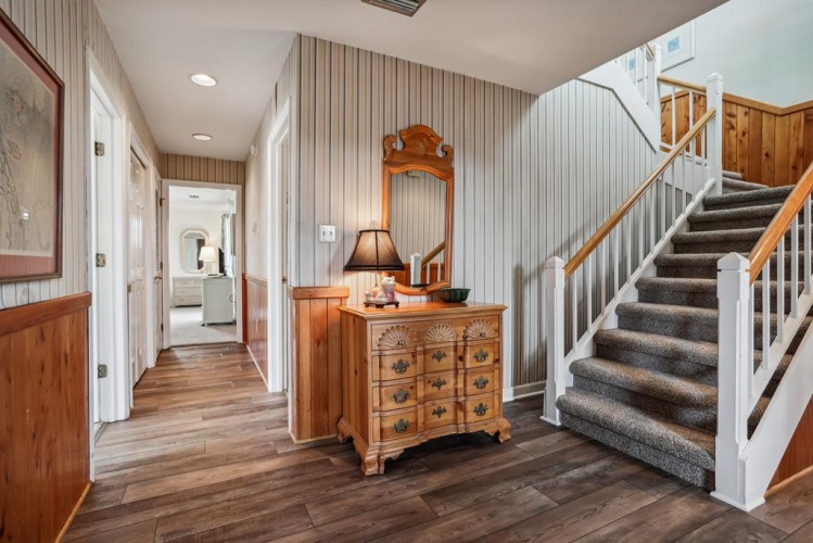Step into your home away from home through this welcoming entryway, where warm wood tones and thoughtful décor set the tone for a relaxing getaway.