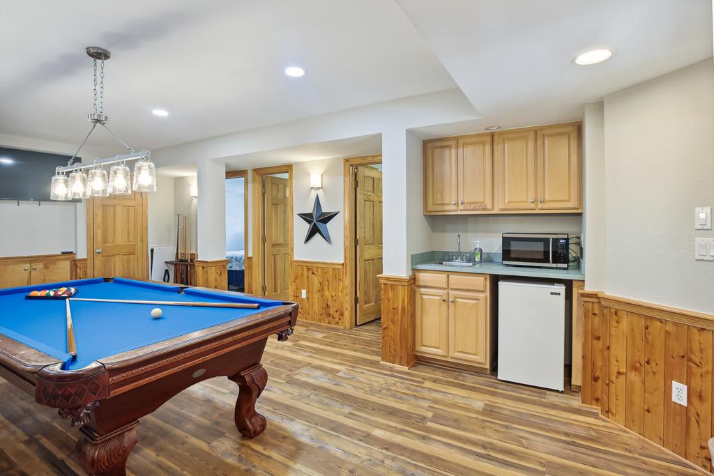 Your own private game room awaits, complete with a full-size billiard table and cozy kitchenette—perfect for friendly competition and late-night snacks.