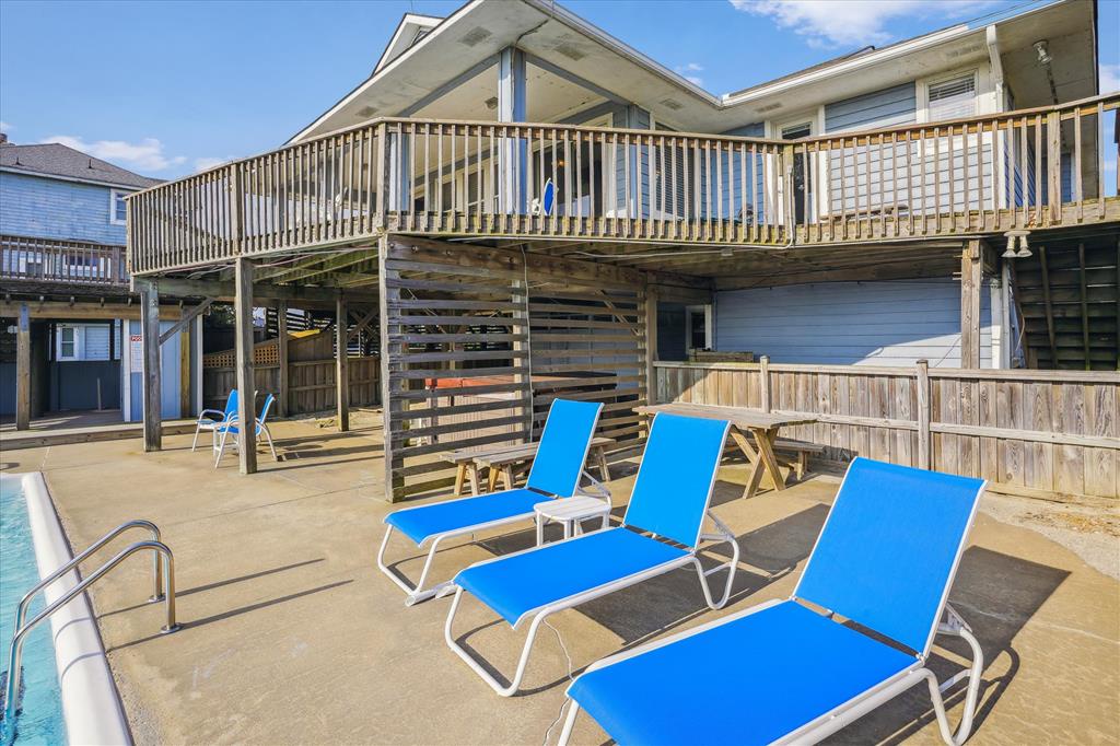 Soak up the sun on your private pool deck with lounge chairs, a shaded gazebo, and an elevated balcony perfect for morning coffee or evening relaxation.