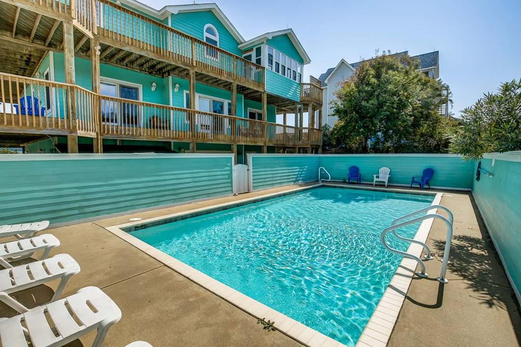 Dive into your private oasis with crystal-clear waters and spacious lounging areas, perfect for soaking up the sun with family and friends.