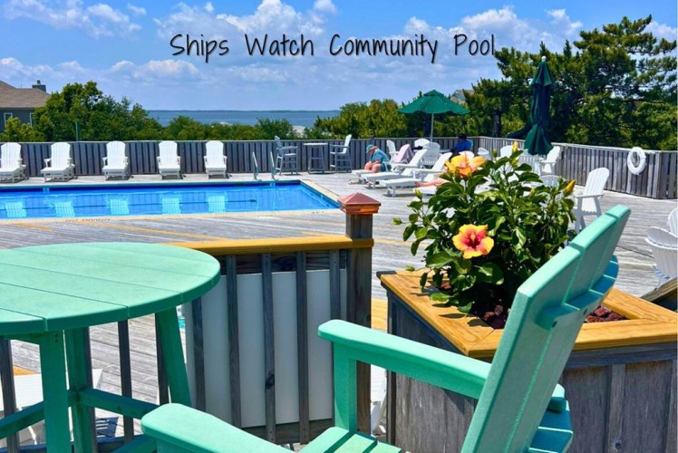Picture yourself lounging by the sparkling pool, soaking up the sun with ocean glimpses beyond. Colorful flowers and cozy seating invite you to unwind poolside all day.