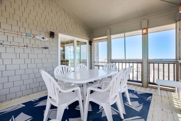 Enjoy morning coffee or sunset cocktails on your private screened porch, with fresh ocean breezes and stunning coastal views as your backdrop.