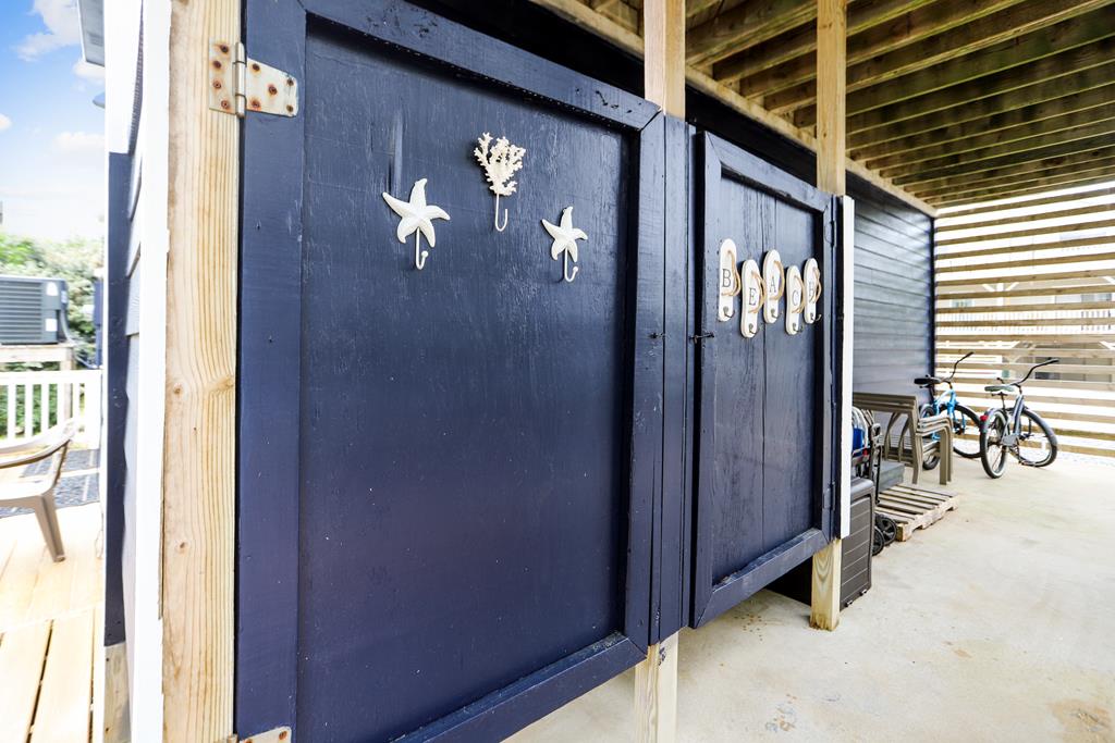 Convenient outdoor storage area provides easy access for beach gear, bikes, and vacation essentials—keeping your stay organized and clutter-free.