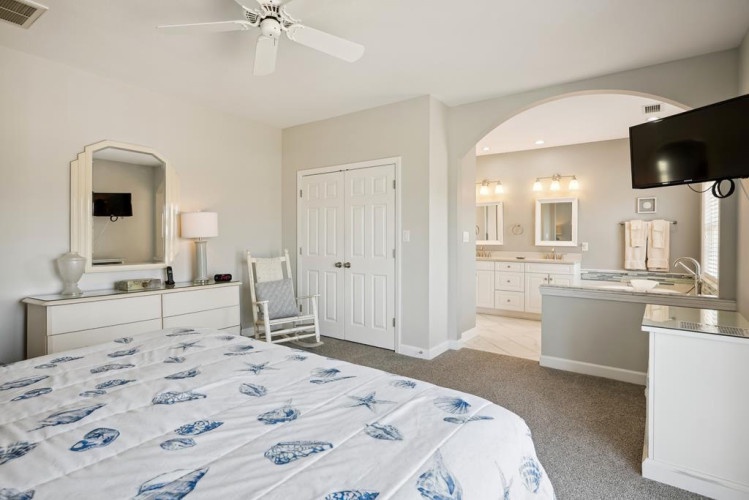Step into your serene retreat with an elegant ensuite, where the coastal-inspired bedroom flows into a spa-like bathroom. Relax in the soaking tub or unwind in your rocking chair after a day of adventure.