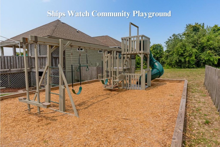 A welcoming community playground with swings, slides, and climbing structures awaits young adventurers exploring the Ships Watch neighborhood under sunny skies.