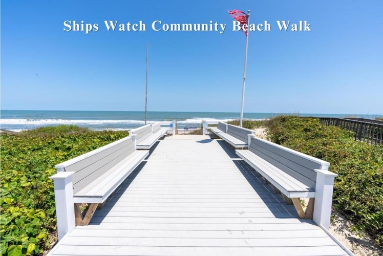 Ships Watch Community Beach Walk offers direct access to pristine shores, with white benches lining a wooden boardwalk that leads straight to sparkling ocean waves and soft sand.