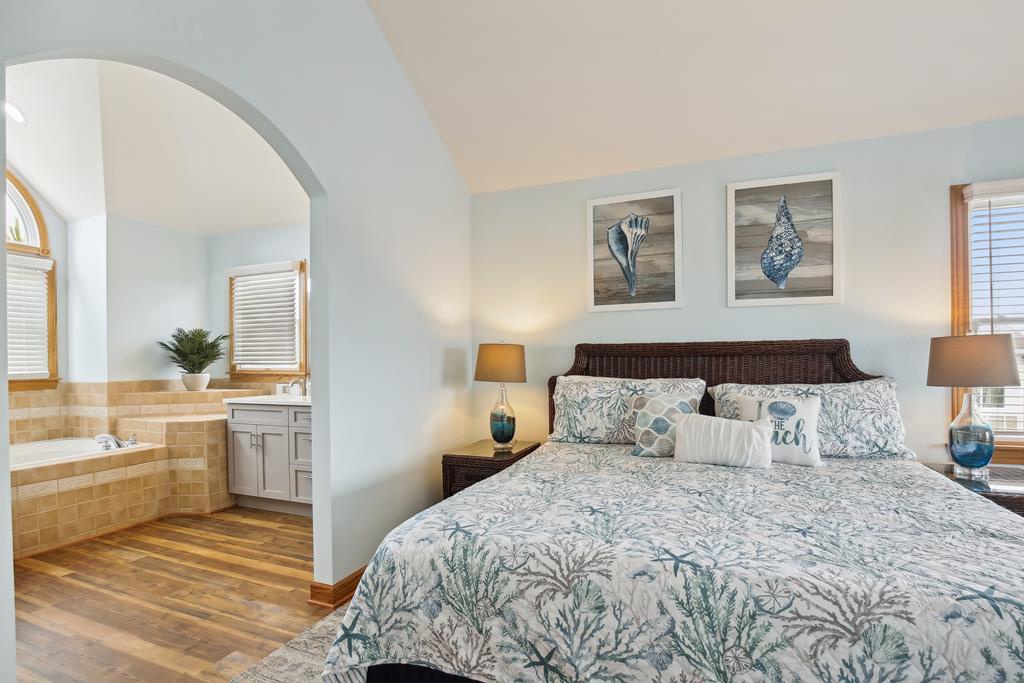 Sink into your coastal-inspired retreat, where calming blues and a plush king bed promise restful nights beside your private ensuite with soothing soaking tub.