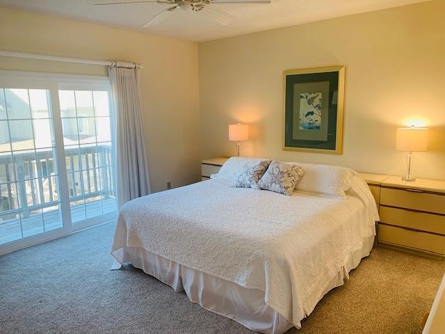 Sink into crisp white linens and wake to sunlight streaming through your private balcony doors. The coastal artwork and warm lighting create a peaceful retreat after beach days.