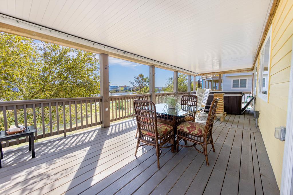Picture yourself relaxing on your private covered deck, where wicker seating invites long conversations and the open views promise peaceful mornings and sun-kissed afternoons.