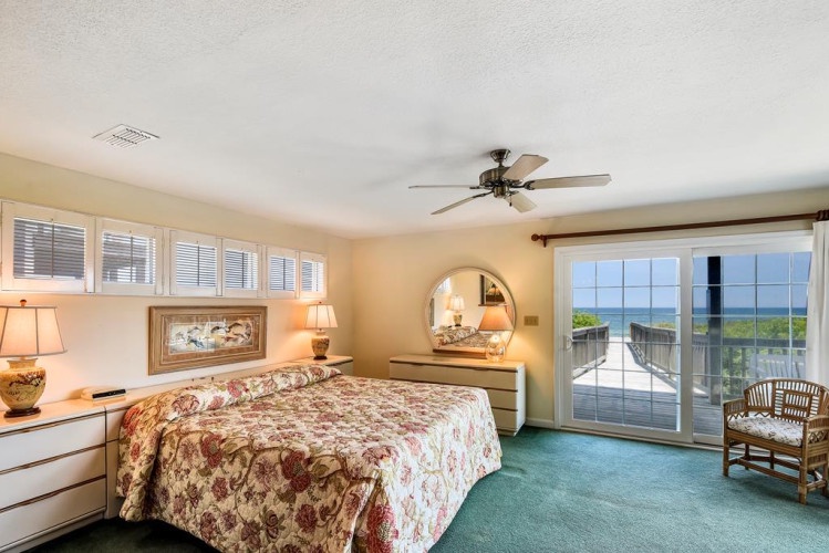 Wake up to stunning ocean views from your bed through French doors opening to your private balcony, framed by soft coastal light and gentle breezes.