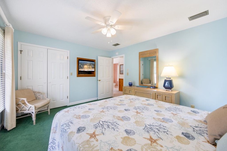 Drift off to sleep in your tranquil coastal retreat, where soft sea-foam walls and gentle lighting create the perfect sanctuary. Ample closet space and thoughtful furnishings ensure your comfort.