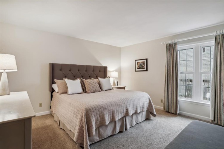 Your serene bedroom awaits with plush bedding, soft lighting, and peaceful views. Unwind in this cozy retreat designed for restful nights.