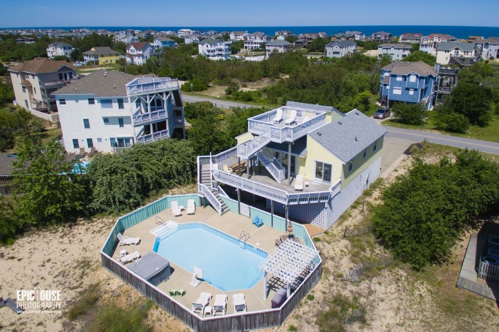 Coastal retreat near the shore with private pool, multiple decks, and spacious layout in a tranquil beachside neighborhood with easy ocean access.