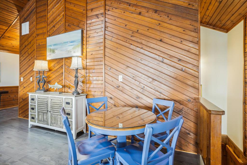 Enjoy meals together at your charming dining nook with warm wood accents and coastal-inspired décor inviting relaxation.