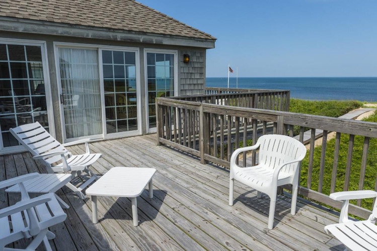 This oceanfront deck overlooks pristine beaches and endless blue horizons—your personal retreat for morning coffee, sunset cocktails, or simply soaking in the coastal breeze and panoramic sea views.
