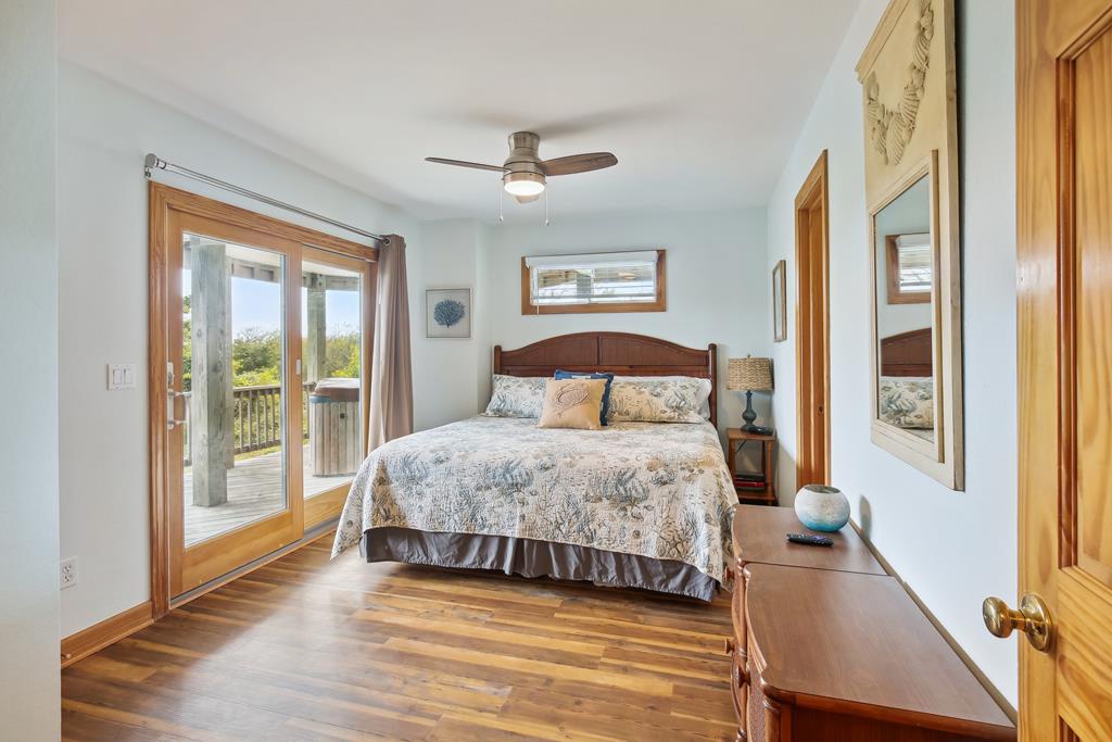 Wake up to soft morning light and coastal breezes in your serene bedroom. Step onto your private deck to soak in the peaceful views, then unwind under the gentle ceiling fan.