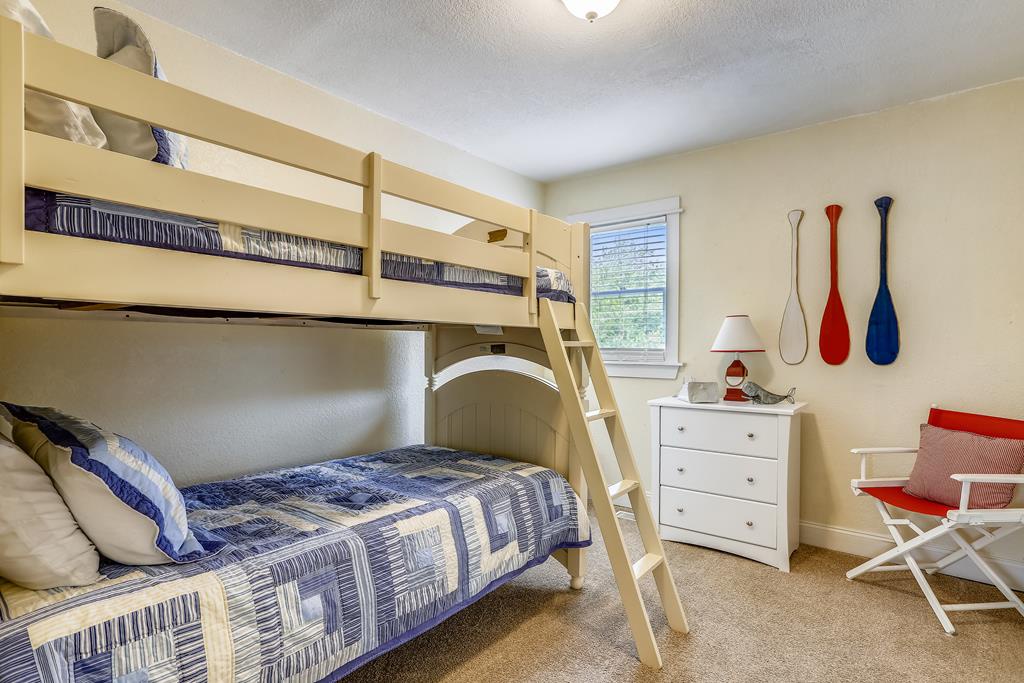 Gather the crew in this charming bunk room where playful nautical touches and cozy beds await your family's bedtime stories and laughter.