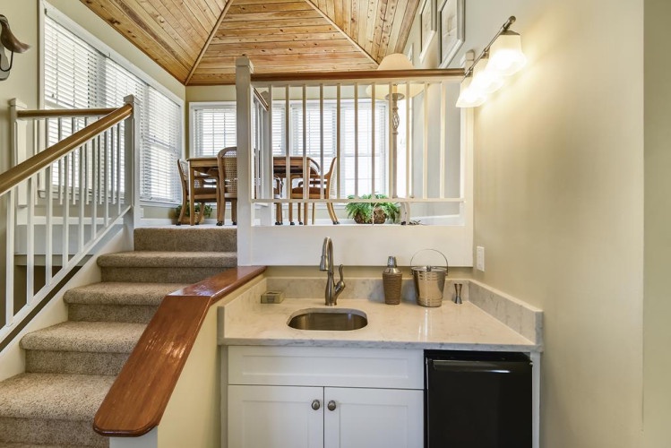 Enjoy your own cozy loft retreat with a convenient kitchenette, warm wood ceilings, and bright open design that makes you feel right at home.
